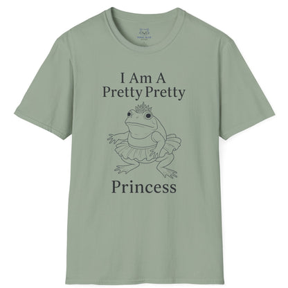 A sage green t-shirt with " I am a pretty pretty princess" black text and a black line drawing of a ballerina princess bullfrog. Princess frog wearing a tutu and tiara.