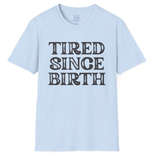 Light blue t-shirt with 'TIRED SINCE BIRTH' text on a white background