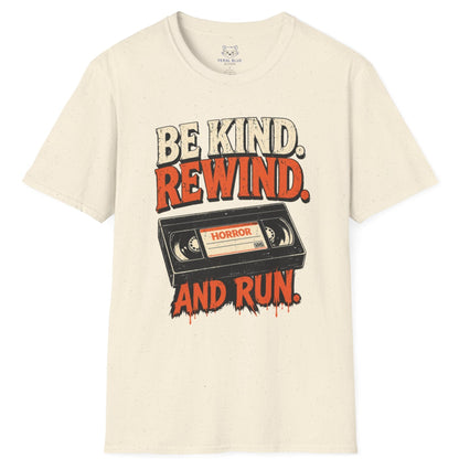 Beige t-shirt with a graphic design of a VHS tape and text 'Be Kind. Rewind. And Run.' on a white background.