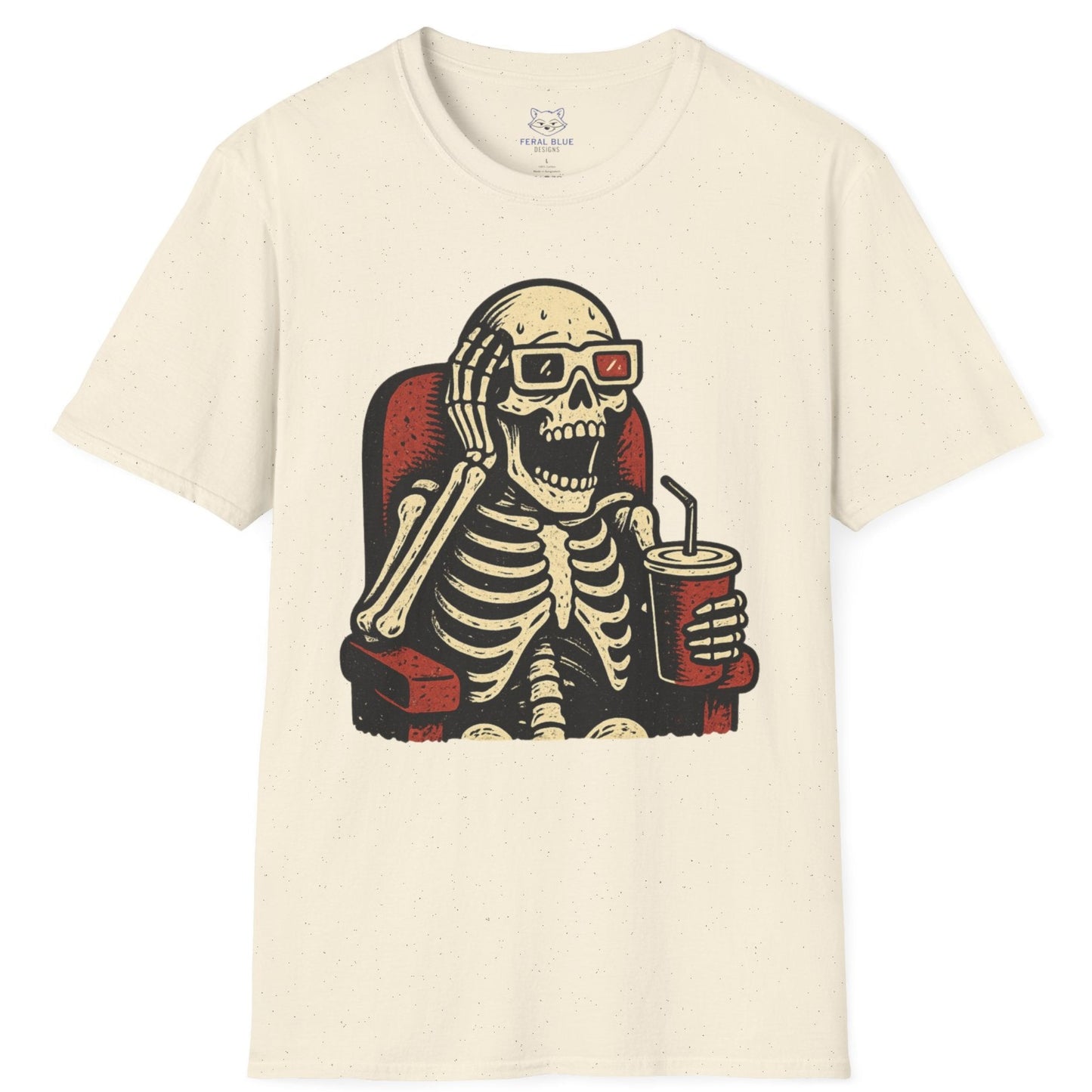 Cream  t-shirt with a skeleton design wearing 3-d glasses, sitting in a theater seat, and holding a drink