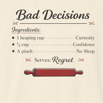 An off-white short-sleeve t-shirt with a graphic print on the front. The print is styled like a recipe titled 'Bad Decisions' with ingredients listed as 'Curiosity', 'Confidence', and 'No Sleep', and a red rolling pin graphic below.