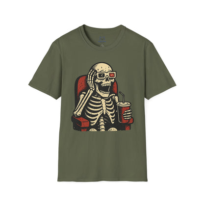 Green t-shirt with a skeleton design wearing 3-d glasses, sitting in a theater seat, and holding a drink