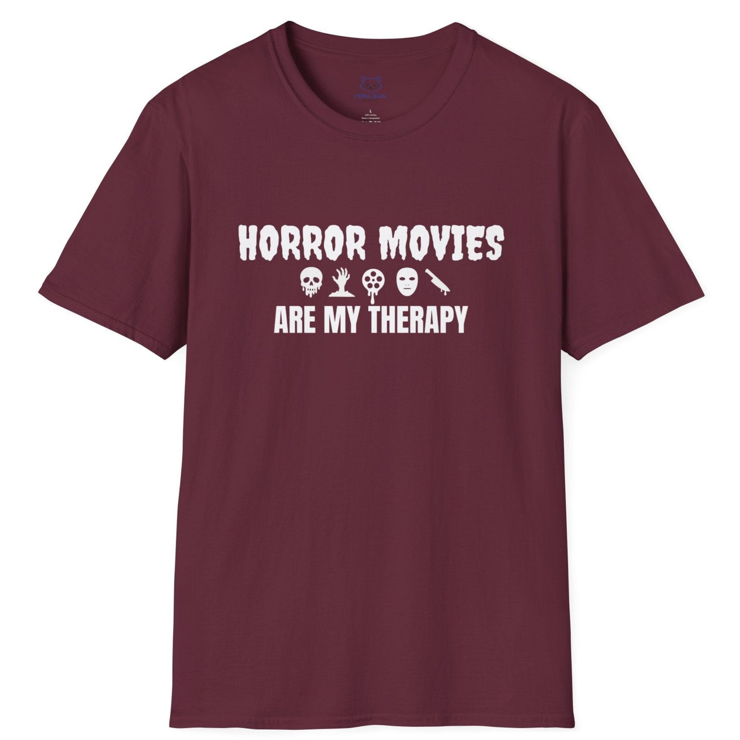 Maroon t-shirt with white text "Horror Movies are my Therapy" and mini horror icon graphics: dripping skull, hand reaching out of ground, dripping film reel, mask, dripping knife.