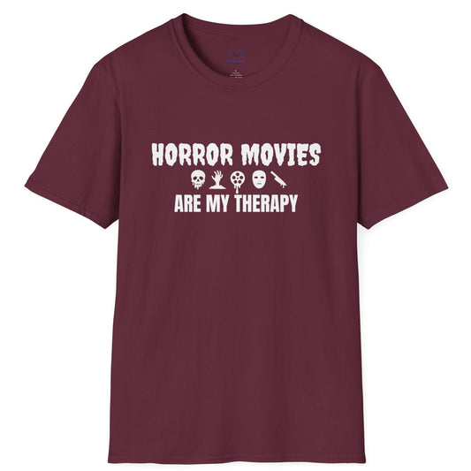 Maroon t-shirt with white text "Horror Movies are my Therapy" and mini horror icon graphics: dripping skull, hand reaching out of ground, dripping film reel, mask, dripping knife.