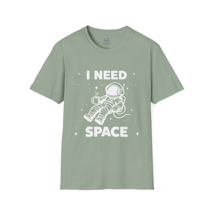 Sage green t-shirt with 'I Need Space' white text and a white graphic of an astronaut floating in space with coffee cup.