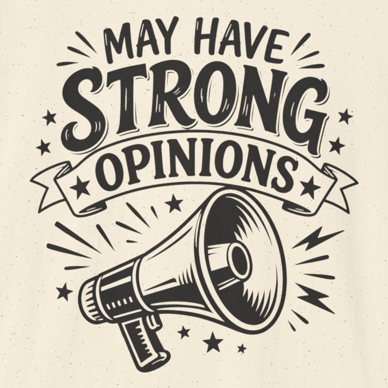 An off-white short-sleeve t-shirt with a black graphic print on the front that reads 'MAY HAVE STRONG OPINIONS' above an illustration of a megaphone.