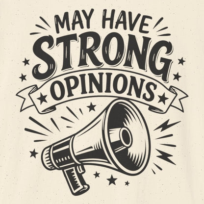 An off-white short-sleeve t-shirt with a black graphic print on the front that reads 'MAY HAVE STRONG OPINIONS' above an illustration of a megaphone.