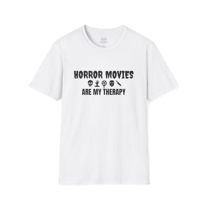 White t-shirt with black text "Horror Movies are my Therapy" and mini horror icon graphics: dripping skull, hand reaching out of ground, dripping film reel, mask, dripping knife.