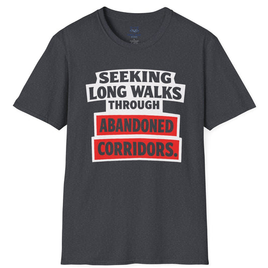 Dark gray t-shirt with text 'Seeking long walks through abandoned corridors' on a white background