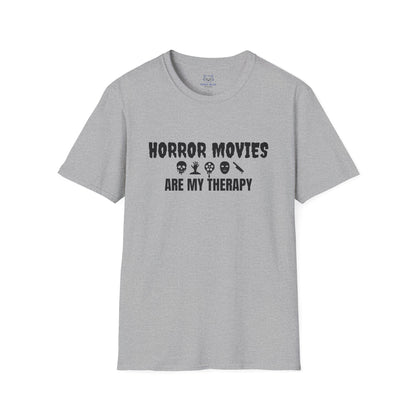 Gray t-shirt with black text "Horror Movies are my Therapy" and mini horror icon graphics: dripping skull, hand reaching out of ground, dripping film reel, mask, dripping knife.