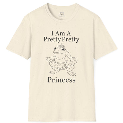 A cream t-shirt with " I am a pretty pretty princess" black text and a black line drawing of a ballerina princess bullfrog. Princess frog wearing a tutu and tiara.