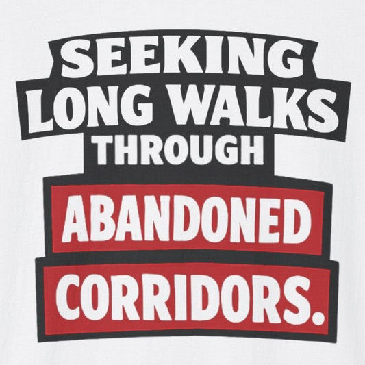 White t-shirt with text 'Seeking long walks through abandoned corridors' on a white background