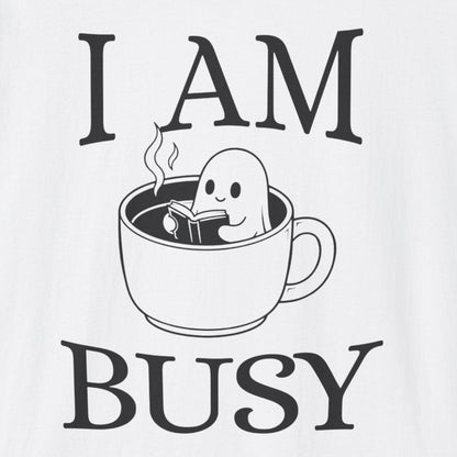 White t-shirt with 'I AM BUSY' graphic and ghost in a coffee cup design on a white background